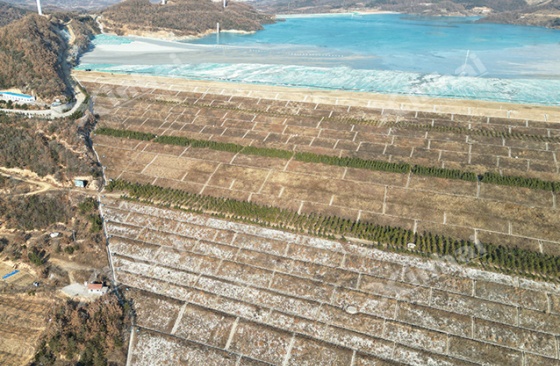 Tailings storage facility holding legacy tungsten tailings