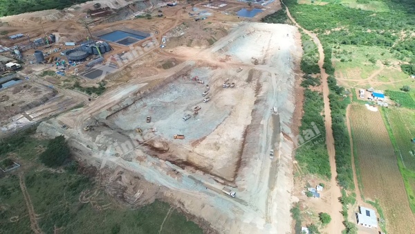 Tailings storage facility under construction beside a gold concentrator